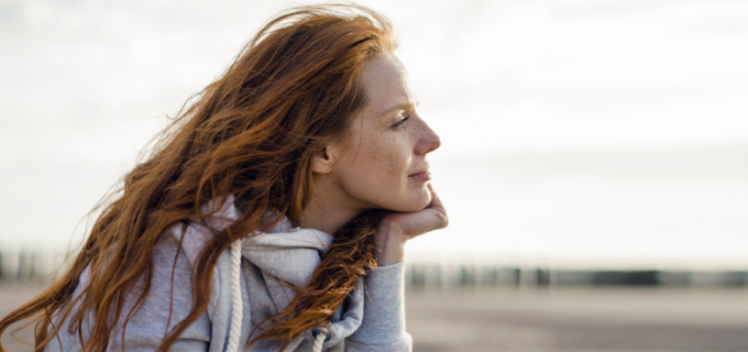 woman looking at sunset