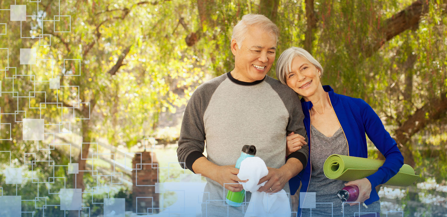Retiree couple exercising in park