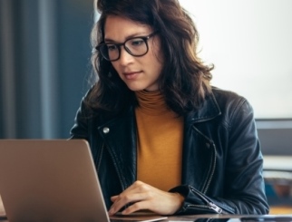 Asian woman working laptop at office.