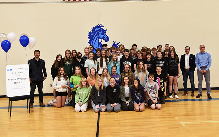 Young students pose at a school where a mental wellness course was provided with support from BCBSMT. 