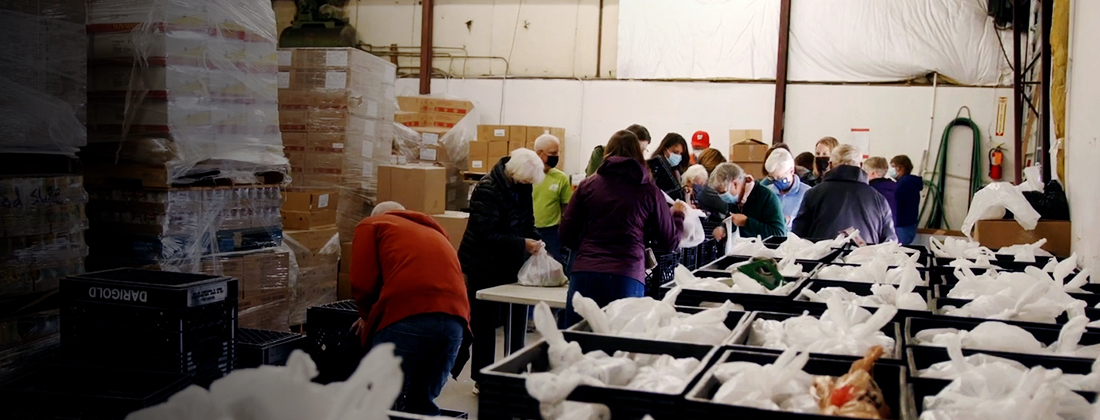 Volunteers organize donated goods